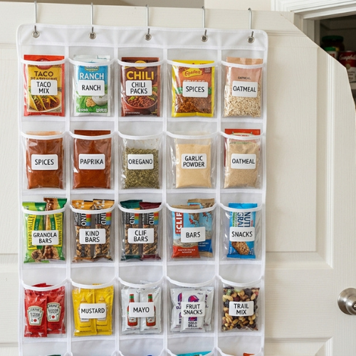 A clear pocket shoe organizer hung on a pantry door