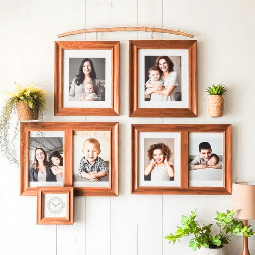 Farmhouse gallery wall with wooden frames family photos rustic decor
