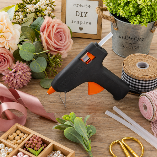 Hot glue gun on craft and diy decor supplies