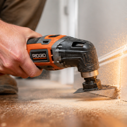 Oscillating multi tool cutting trim in home renovation project
